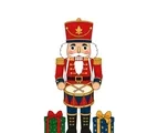 Full-body Christmas nutcracker with tall hat, toy drum, crossed drumsticks and two wrapped gifts.