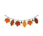 Curved Thanksgiving garland with seven autumn leaves and two acorns attached to a brown cord.