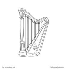 Golden Irish-style harp with evenly spaced strings, green accents, and a small shamrock on the soundbox.