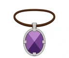 Oval jeweled amulet with a broad brown leather cord and simple gold metal setting.