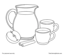 Glass pitcher of amber apple cider with two cream cups, a red apple slice, and two cinnamon sticks.
