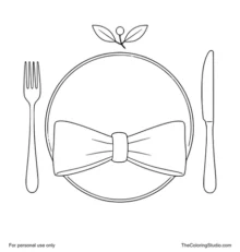 Top-down Thanksgiving place setting with cream plate, terracotta napkin, fork, knife, and small autumn sprig.